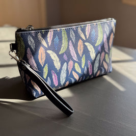 the featherlight clutch collection in vegan leather