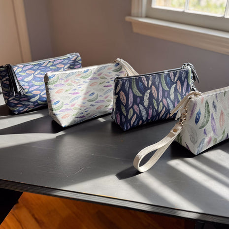 the featherlight clutch collection in vegan leather