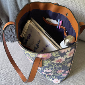 Vegan Leather clutch or makeup bag in Delphinium shown inside our carryall in Airy Cosmos.